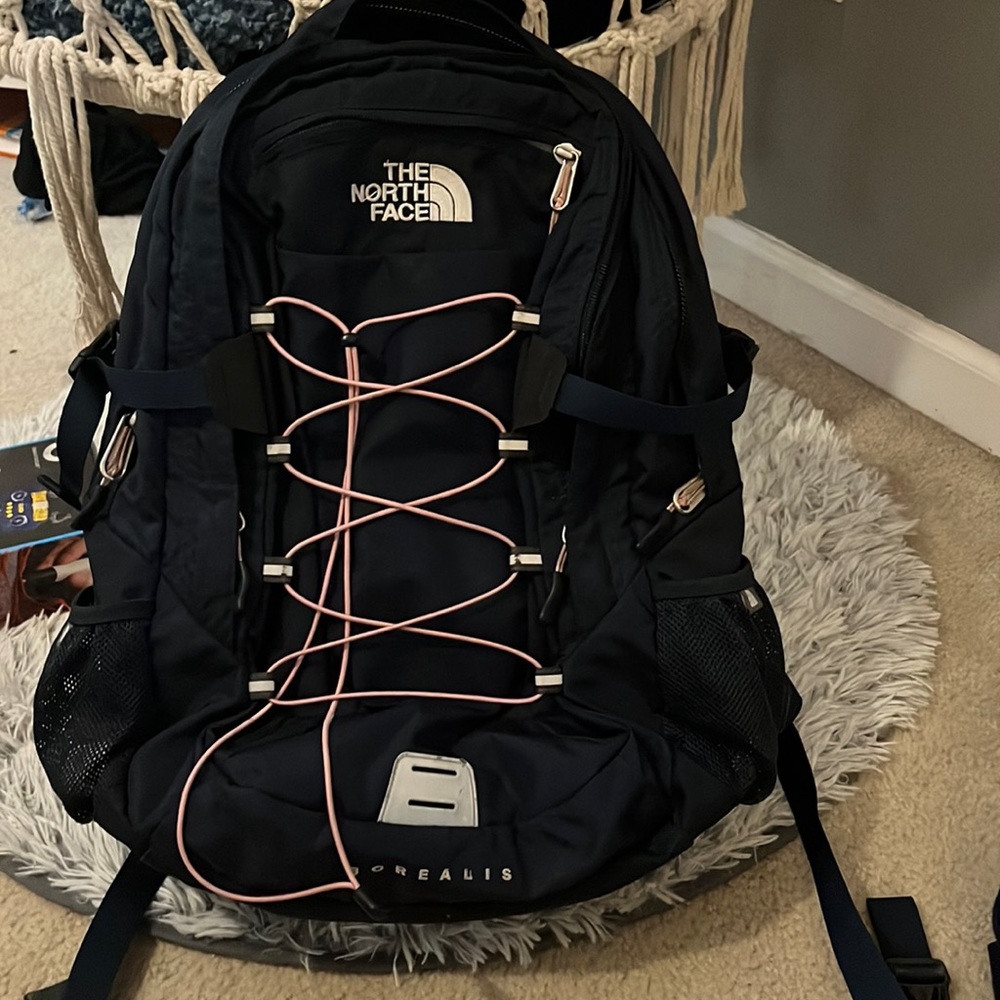 North face navy blue and pink tie book bag. Great for school:)